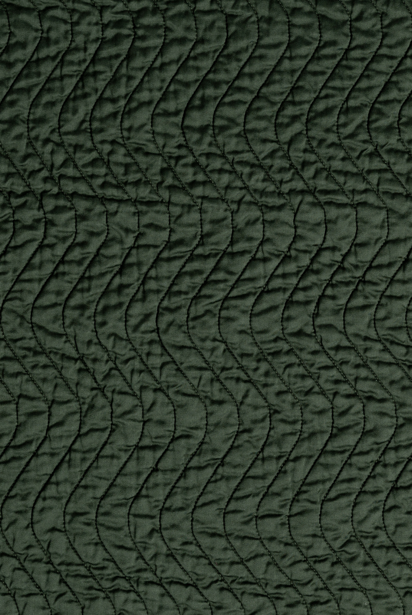 Juniper: A close up of quilted cotton sateen fabric in Juniper, a deep green tone.
